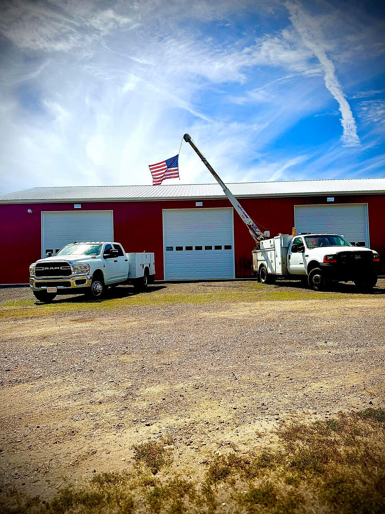 The Faith Driven Diesel shop in Preston with two service trucks out front